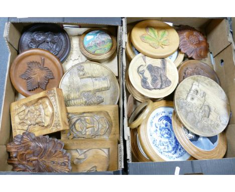 A collection of hand turned and carved panels and roundels with portrait and landscape views 