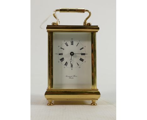 Brass carriage clock dial reads Bormond Freres Bicester: Winds, ticks and runs, complete with key.  Measures 15chm high inc. 