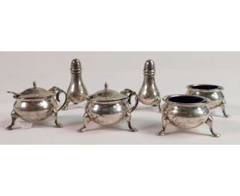 A silver cruet set hallmarked for London 1953: comprising pair salts, pair mustard pots and pair pepper pots, with liners and
