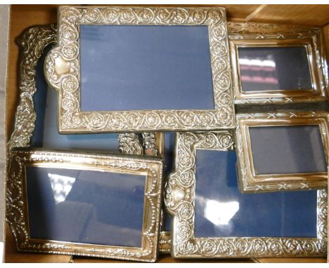 A collection of Silver photo frames in various shapes and sizes (7) 