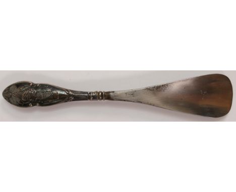 Silver handled shoehorn decorated with cherubs, Birmingham 1906, in exceptional, crisp condition, 21cm long. 