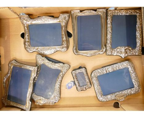 A collection of Silver photo frames in various shapes and sizes (7) 