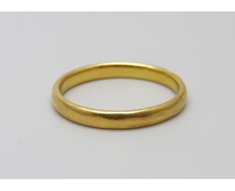 A 22ct gold ring, 2.8g, L, (band slightly misshapen)