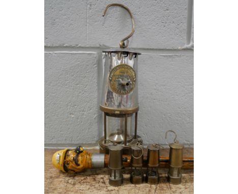 Four miniature miners lamps, an Eccles Type 6 Proctector officials miners lamp, adapted and an officials stick