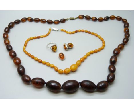 A collection of amber and amber style jewellery including a silver mounted ring 
