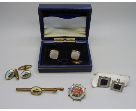 A pair of Queen Mary cruise liner cufflinks with matching tie-clip, an enamelled badge and two other pairs of cufflinks