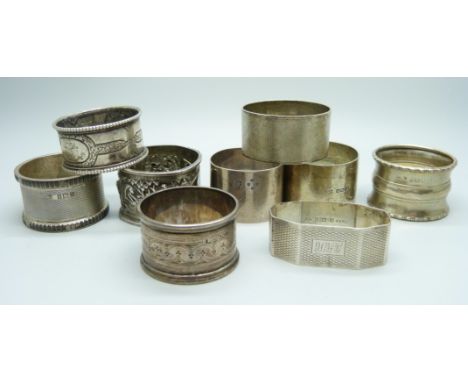 Eight hallmarked silver napkin rings, 208g, and a white metal Oriental napkin ring
