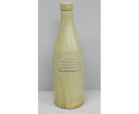 A slab seal stoneware porter bottle impressed, 'Turner’s Wine &amp; Spirit Vaults, New Radford, Nr. Nottingham', 26cm