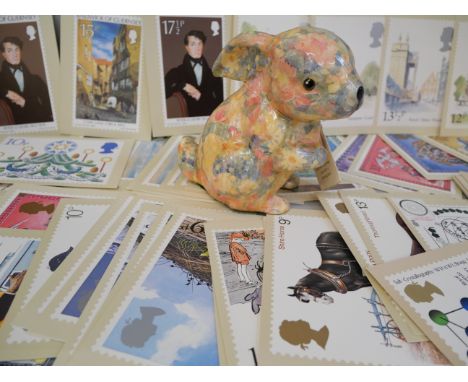 A collection of first day covers, PHQ cards, postcards and a Global Studios fine ceramic rabbit