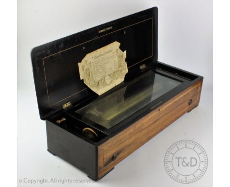 A 19th century Swiss musical box, playing eight airs on a 32.5cm cylinder, with inlaid rosewood and faux rosewood case, 63cm 