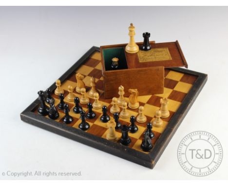 A Jaques Staunton pattern box wood and ebony chess set, the kings stamped 'Jaques London', two of the rooks and two of the kn