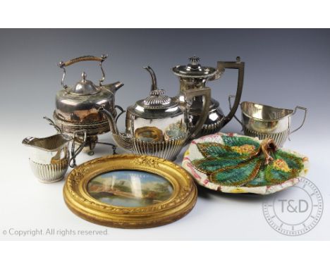 A silver plated three piece tea service, with a silver plated coffee pot, a silver plated spirit kettle on stand, a majolica 