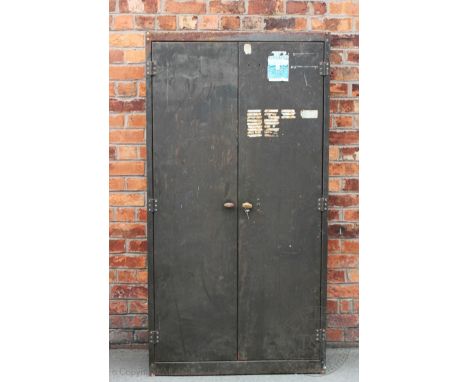 A vintage industrial metal cabinet, with two doors enclosing shelves, 176cm H x 92cm W, with a smaller metal open bank of she