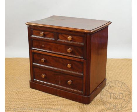 A Victorian mahogany commode chest, with faux drawer front, on plinth base 71cm H x 72cm W 50cm D (as found) and a Victorian 