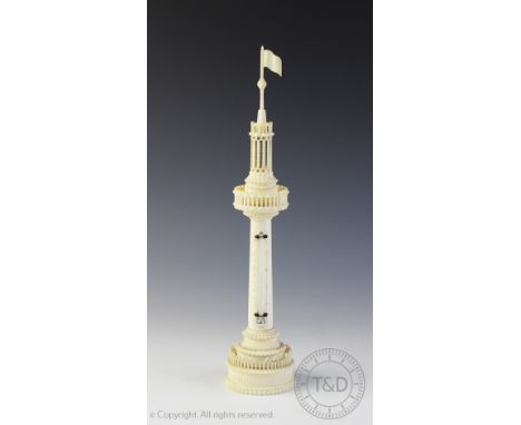 A 19th century carved ivory thermometer, modelled as a pierced tower with flag finial, 30cm CONDITION REPORT: Please note: Tr