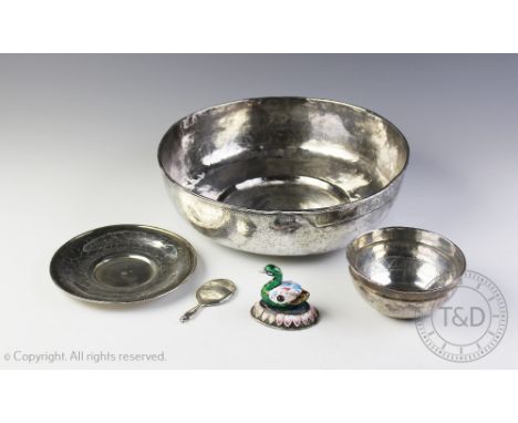 A Persian white metal bowl, the inside decorated with a central medallion and band of stylized script, 25cm diam (at fault), 