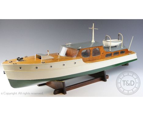 A Keelbild model boat 'The Dolphin', a cabin cruiser with white and green painted hull and original blue print from The Model