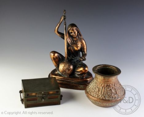 A Eastern copper model of a seated female playing a string instrument, 28cm high, an embossed copper vessel, signed, 12cm hig
