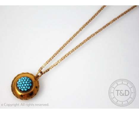 A Victorian turquoise set pendant/locket, the circular pendant with central turquoise set panel and rope twist surround, lock