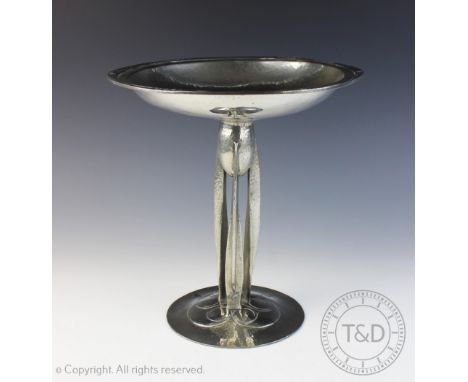 An Art Nouveau pewter tazza designed by Archibald Knox, in the manner of Liberty & Co, the circular domed foot below a tripar