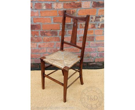 An Arts and Crafts stained beech chair - in the manner of Charles Francis Annesley Voysey, the splat decorated with a heart m