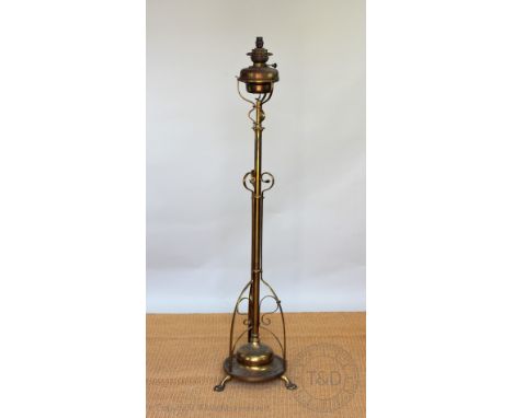 An Edwardian lacquered brass oil standard lamp, 174cm high    CONDITION REPORT:  Lighting lots are sold as decorative items o