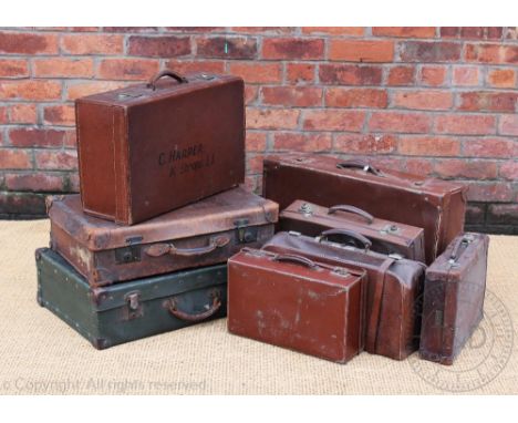 A selection of seven vintage suitcases, longest 66cm, with a leather Gladstone type bag 