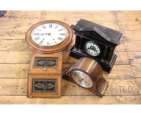An early 20th century stained walnut wall clock, the circular face with black Roman numeral dial above two verre eglomise typ