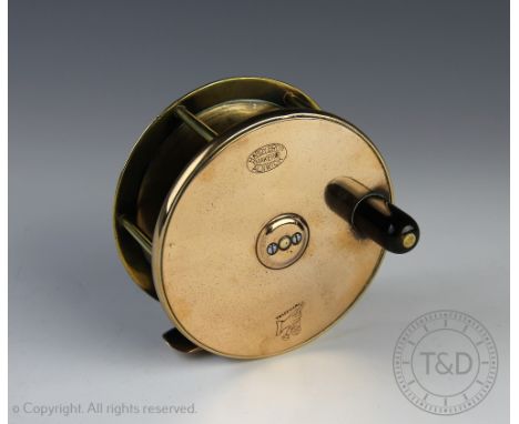 A vintage Hardy brass and alloy 10cm fishing reel, with horn handle, the drum stamped 'Hardy Bros makers Alnwick' and with tr