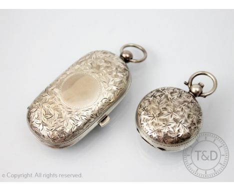 A silver double sovereign holder, Birmingham 1900, with all over floral and foliate detail and vacant cartouche, 6.5cm wide a