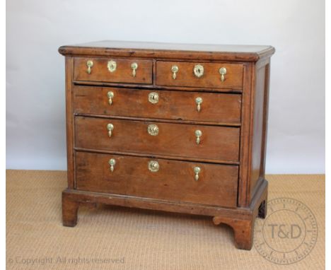An early 18th century and later oak chest, with two short and three graduated long drawers, on bracket feet, 92cm H x 96cm W 