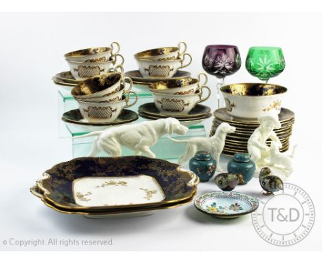 An Aynsley thirty five piece part tea service, with gilt floral detailing against a blue ground, with two glass hock glasses,