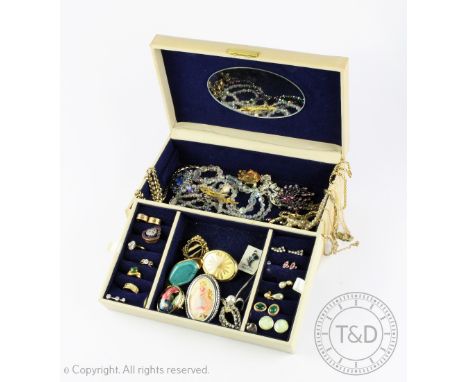 A selection of vintage and costume jewellery to a cream coloured box to include; gold coloured chains, necklaces, earrings, s