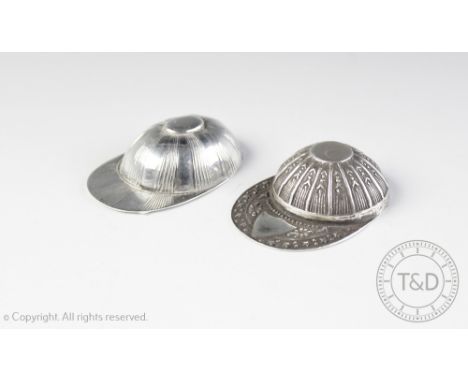 Two novelty caddy spoons each designed as a Jockey cap, each stamped '925 Sterling', embossed with vacant cartouche and linea