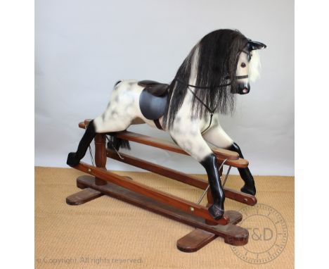 A modern painted wood and composition rocking horse, on walnut base, 134cm H   CONDITION REPORT:  General light wear / knocks