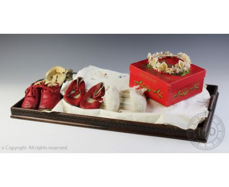 A selection of vintage costume and textiles to include five pair of children's leather and crochet shoes, babies bibs etc and