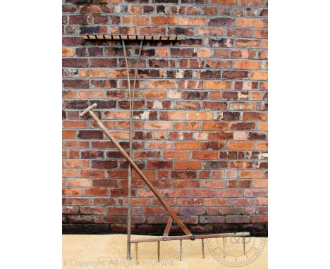 Two vintage wooded hay rakes, longest 169cm, with two scythes (4)