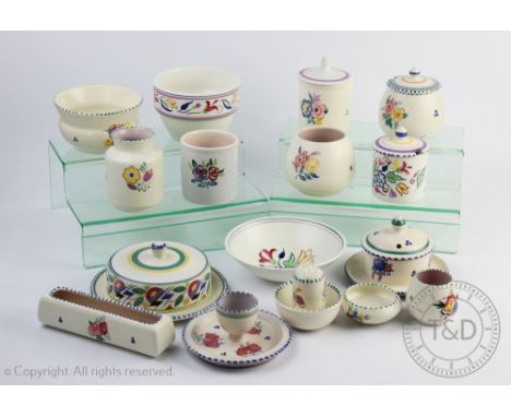A selection of Poole pottery to include; two preserve pots and covers, a pepper cellar, assorted bowls and stands etc (Qty)