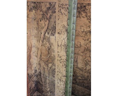 A large four fold screen, decorated with a 18th century tapestry style design material, with later leather stud trim, 177cm h