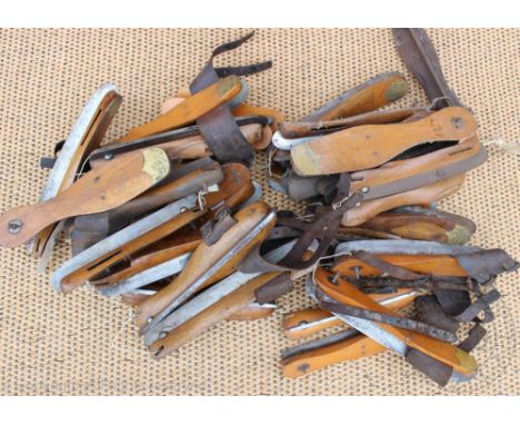 A collection of Victorian and later vintage ice skates, brass, treen and steel, including names such as Marsden Brothers, Fle