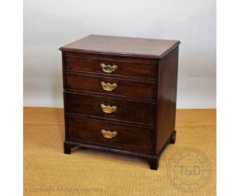 A late George III mahogany commode, modelled as a four drawer chest, on bracket feet, 70cm H x 64cm W x 45cm D