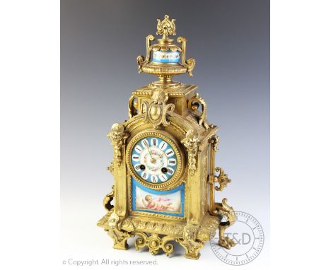 A 19th century French gilt metal eight day mantel clock, with Roman numeral Sevres style porcelain dial and movement striking