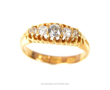 A late-Victorian, 18 ct yellow gold and five stone diamond ring, composed of a vertical row of five, graduated, brilliant-cut