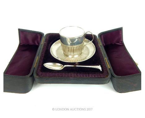 A late Victorian presentation silver coffee cup, saucer and spoon. London, 1892, William Hutton and Sons. with fluted decorat
