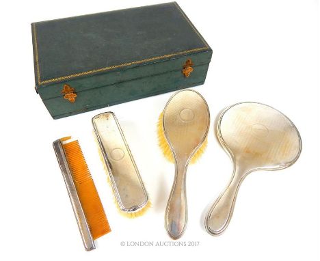 A George VI four piece dressing table set, Birmingham, 1947, Mappin & Webb Ltd, engine turned decoration, comprising: hand mi