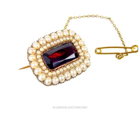 A Georgian, rose gold, seed pearl and faceted garnet brooch, composed of a central, large, rectangular, faceted garnet (1.4 x
