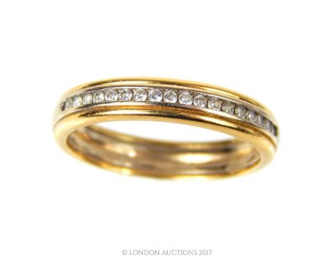 An 18 ct yellow gold and diamond half-set eternity band, set centrally with a row of eighteen, round, brilliant cut diamonds 