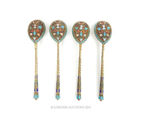 A set of four early 20th century pre-revolution Russian silver gilt and cloisonne enamel teaspoons, 10cm long, 59g (1.92 t oz