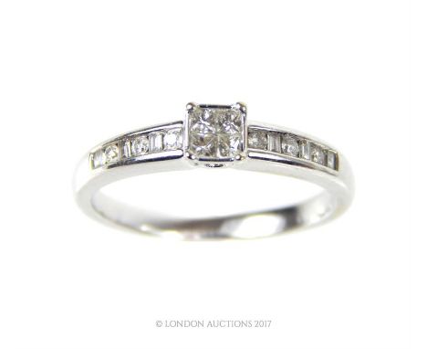 A fine, boxed, 18 ct white gold and diamond solitaire style ring, the central solitaire stone composed of four, square-shaped