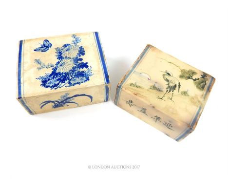 Two Chinese ceramic opium pillows, the larger decorated with a bird, butterfly and blossom upon a branch (16cm x 13cm x 7cm) 